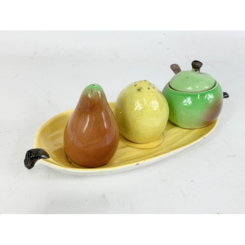 560 - A collection of pottery. Including a Sylvac bowl 18 x 9cm, a Carlton Ware cruet set, 2 Indian Tree v... 