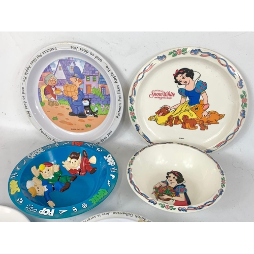 563 - A quantity of vintage children’s dinnerware by Cole & Mason. Snow White, Postman Pat etc.