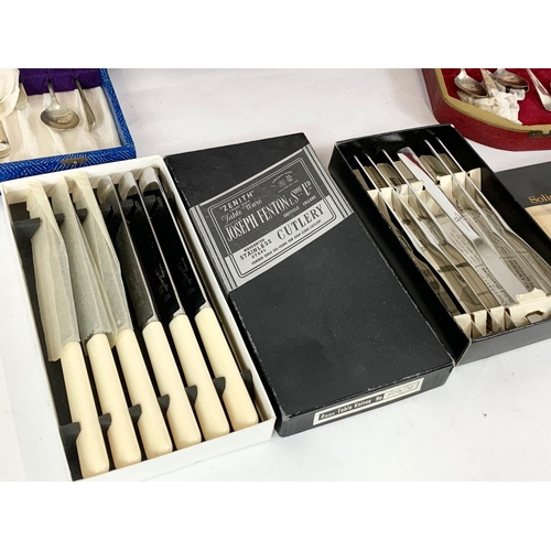 570 - A quantity of vintage silver plated cutlery in cases. 37cm