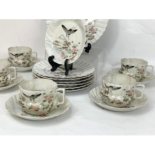 574 - An 18 piece Japanese porcelain tea set.