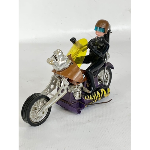 59 - A collection of vintage toys. An Evel Knievel Formula 1 Dragster car by Ideal 1974, a 1971 Hasbro Sc... 