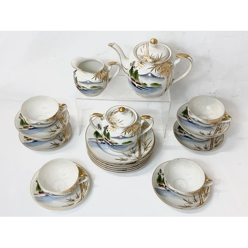 605 - A 21 piece Japanese tea set.