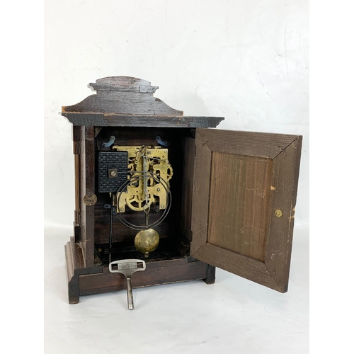 63 - A late 19th century Badische Uhrenfabrik German mantle clock with key and pendulum. 24.5 x 15.5 x 35... 