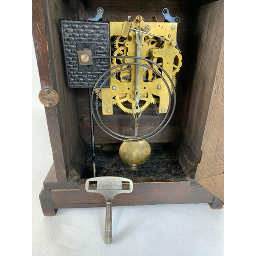 63 - A late 19th century Badische Uhrenfabrik German mantle clock with key and pendulum. 24.5 x 15.5 x 35... 