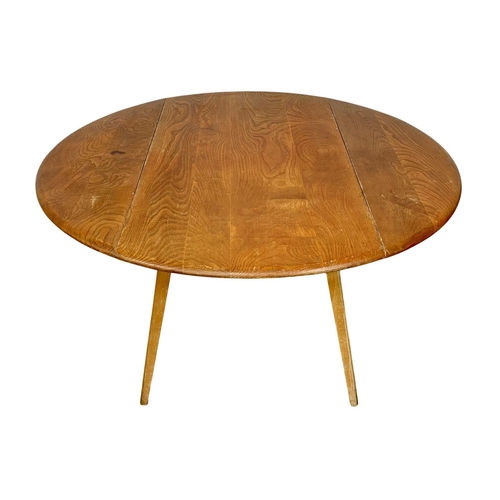 781 - A Blonde Ercol model 383 drop leaf dining table. Mid Century. 1960. 124 x 113 x 71.5cm.