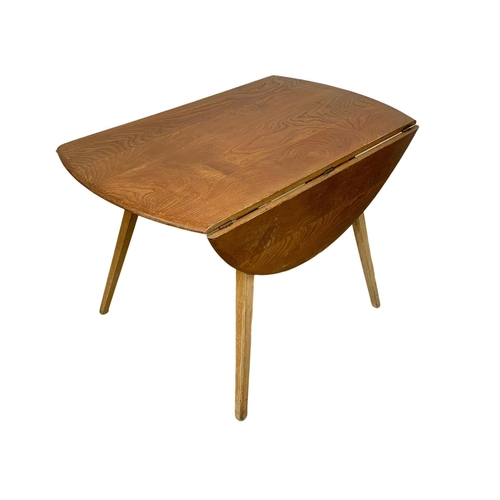 781 - A Blonde Ercol model 383 drop leaf dining table. Mid Century. 1960. 124 x 113 x 71.5cm.