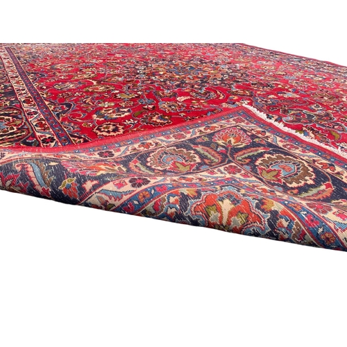 787 - A very large vintage Middle Eastern rug. 296 x 393.