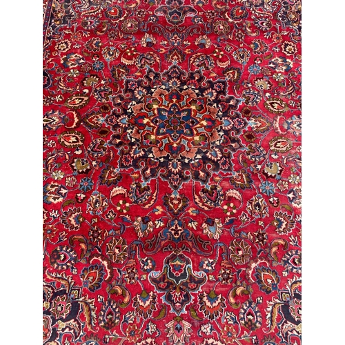 787 - A very large vintage Middle Eastern rug. 296 x 393.