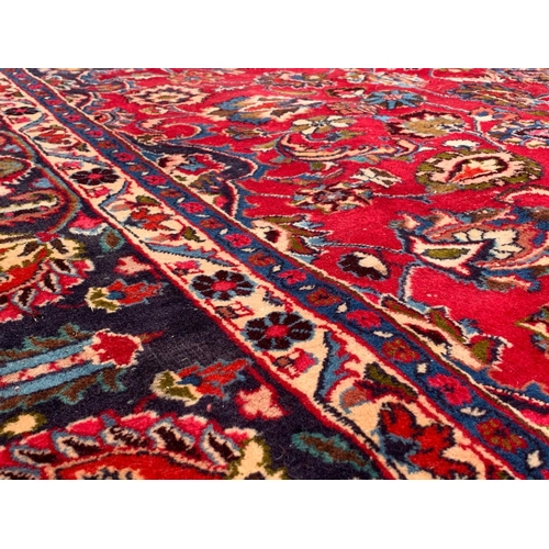 787 - A very large vintage Middle Eastern rug. 296 x 393.