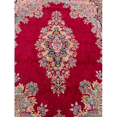 788 - A very large vintage Middle Eastern hand knotted rug. 299 x 404cm