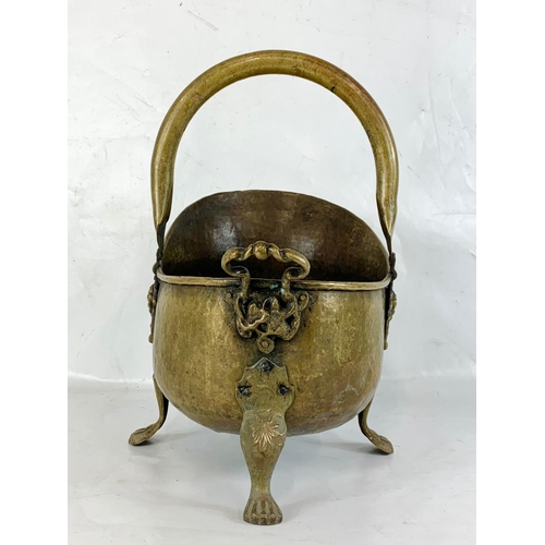 79 - An early 20th century brass coal scuttle and a vintage fire screen. Scuttle measures 35 x 26 x 46cm ... 