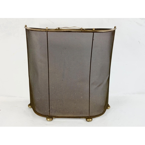 79 - An early 20th century brass coal scuttle and a vintage fire screen. Scuttle measures 35 x 26 x 46cm ... 