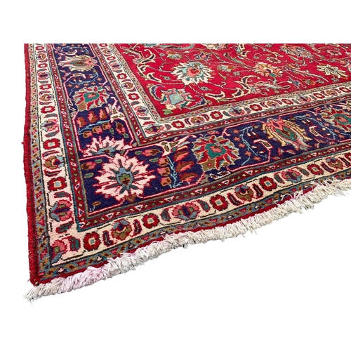 790 - A very large vintage Middle Eastern hand knotted rug. 294 x 343cm