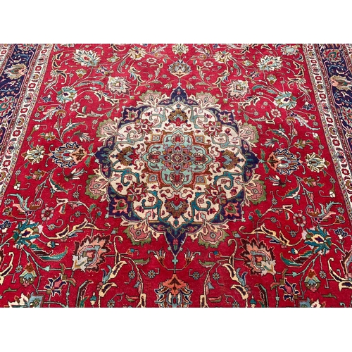 790 - A very large vintage Middle Eastern hand knotted rug. 294 x 343cm