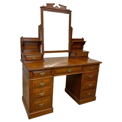 793 - A late Victorian walnut dressing table. Circa 1900. 127 x 55.5 x 166.5cm