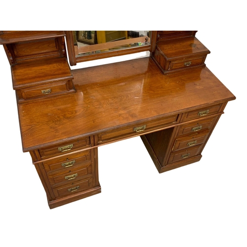 793 - A late Victorian walnut dressing table. Circa 1900. 127 x 55.5 x 166.5cm