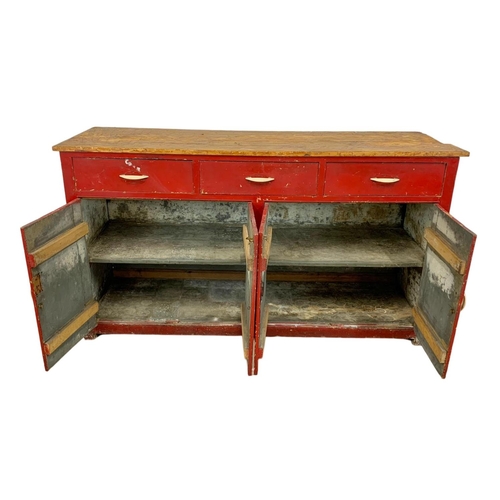 797 - A large Victorian painted pine counter with 3 drawers and 4 door cupboard. Circa 1890. 178 x 58 x 98... 