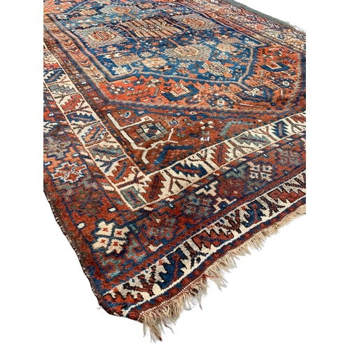 799 - A large vintage Middle Eastern hand knotted rug. 178.5 x 280cm.