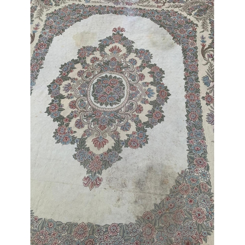 801 - A very large rug. 269 x 350cm.