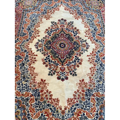 802 - A very large vintage Middle Eastern hand knotted rug. 250 x 334cm.