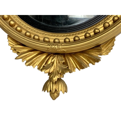 802a - A Thomas Fentham Regency gilt framed convex mirror. Circa 1810-1815. 59 x 90cm