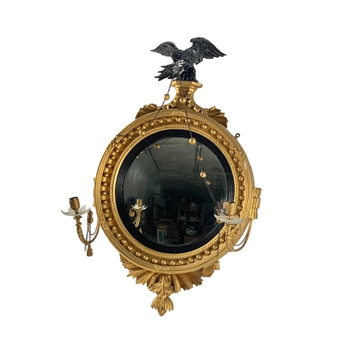 802a - A Thomas Fentham Regency gilt framed convex mirror. Circa 1810-1815. 59 x 90cm