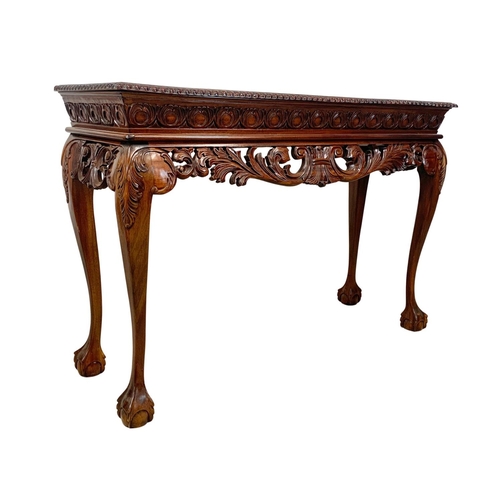 806 - A large Irish Chippendale style carved mahogany console table. 149 x 49 x 100.5cm.