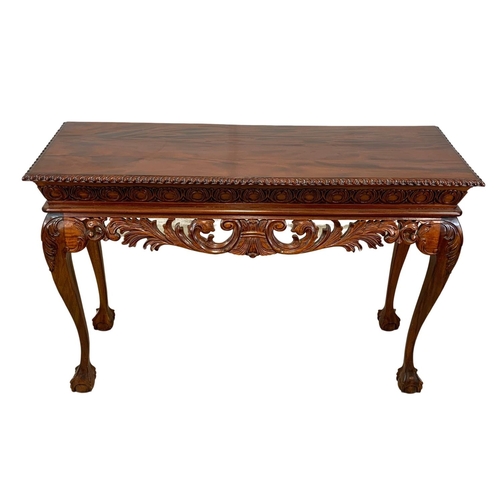 806 - A large Irish Chippendale style carved mahogany console table. 149 x 49 x 100.5cm.