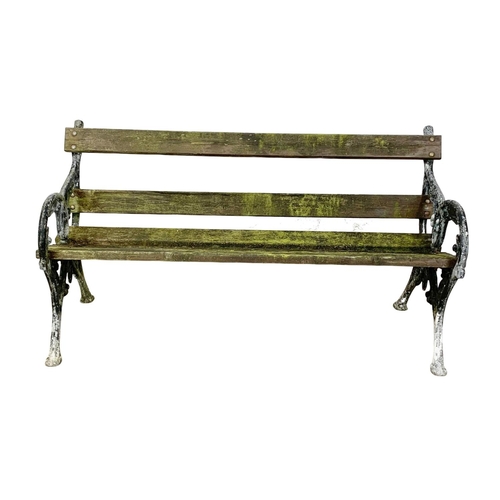 807 - An early 20th century garden bench with cast iron ends. 147.5cm