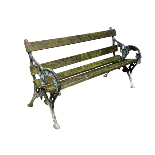 807 - An early 20th century garden bench with cast iron ends. 147.5cm