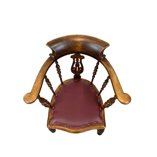 808 - A large Victorian elm and beech armchair with brown vinyl seat. 66 x 52 x 89.5cm.