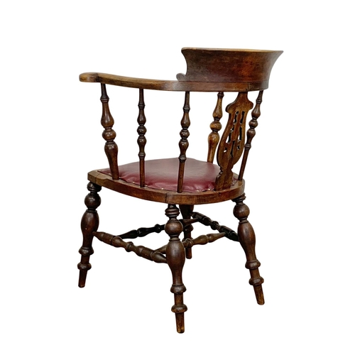 808 - A large Victorian elm and beech armchair with brown vinyl seat. 66 x 52 x 89.5cm.