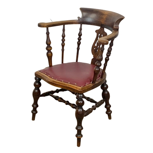 808 - A large Victorian elm and beech armchair with brown vinyl seat. 66 x 52 x 89.5cm.