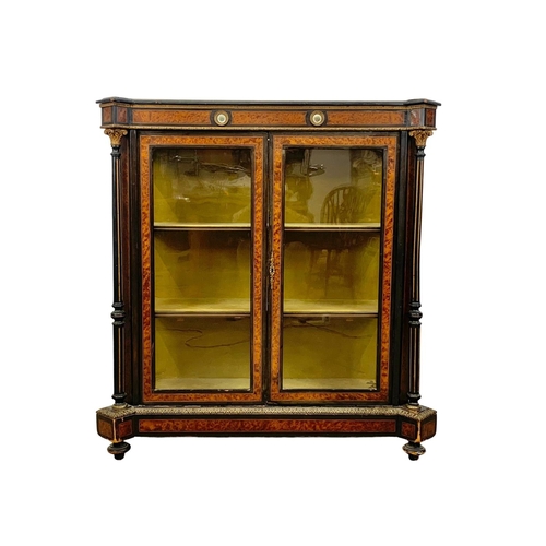 809 - A Victorian ebonised pier cabinet with inlaid ambonya and brass ormolu mounts. Circa 1860. 101 x 37.... 