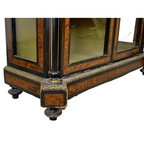 809 - A Victorian ebonised pier cabinet with inlaid ambonya and brass ormolu mounts. Circa 1860. 101 x 37.... 