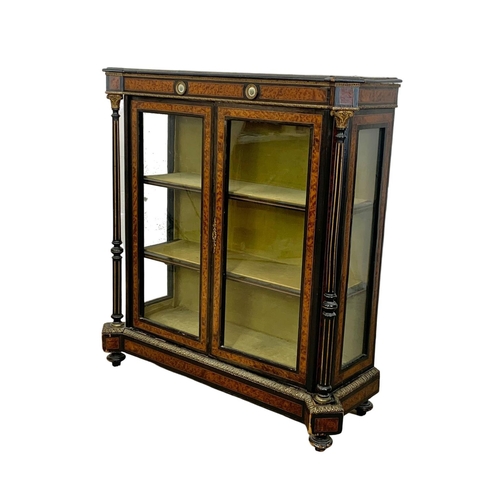 809 - A Victorian ebonised pier cabinet with inlaid ambonya and brass ormolu mounts. Circa 1860. 101 x 37.... 