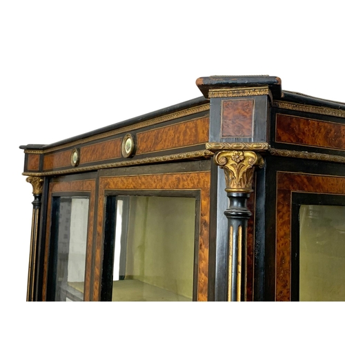 809 - A Victorian ebonised pier cabinet with inlaid ambonya and brass ormolu mounts. Circa 1860. 101 x 37.... 