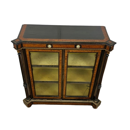 809 - A Victorian ebonised pier cabinet with inlaid ambonya and brass ormolu mounts. Circa 1860. 101 x 37.... 