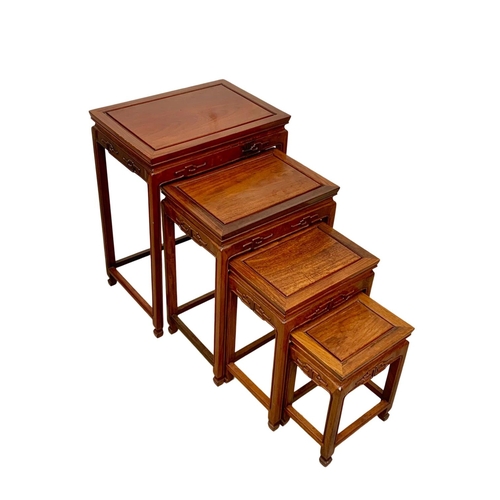 811 - A Chinese teak nest of 4 tables. 50.5 x 35.5 x 68.5cm