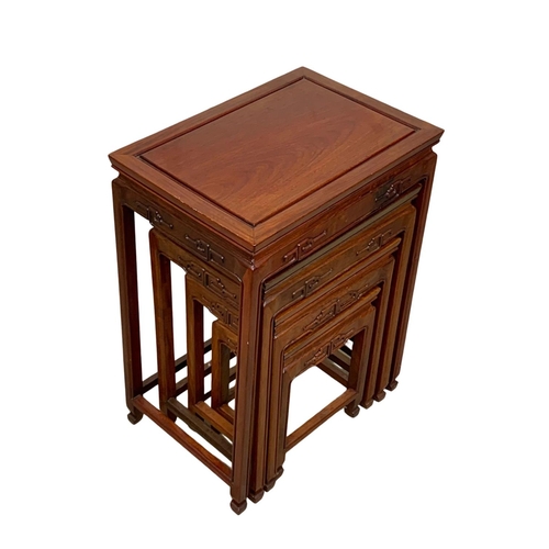 811 - A Chinese teak nest of 4 tables. 50.5 x 35.5 x 68.5cm