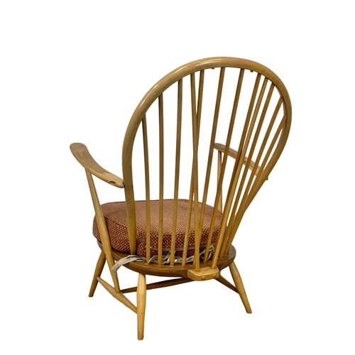 812 - An Ercol Blonde elm Grandfather armchair. Model 317. 74 x 59 x 95cm