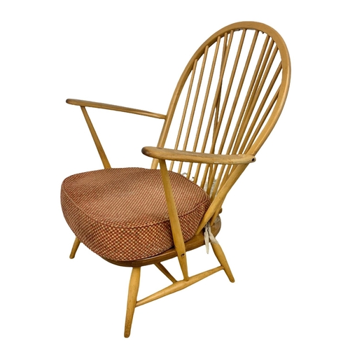 812 - An Ercol Blonde elm Grandfather armchair. Model 317. 74 x 59 x 95cm