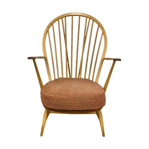 812 - An Ercol Blonde elm Grandfather armchair. Model 317. 74 x 59 x 95cm