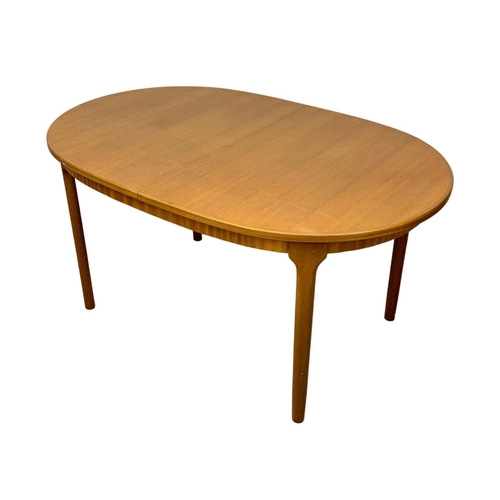 824 - A McIntosh teak Mid Century extending dining table and 6 chairs. Extended 205 x 98 x 76cm. Closed 15... 