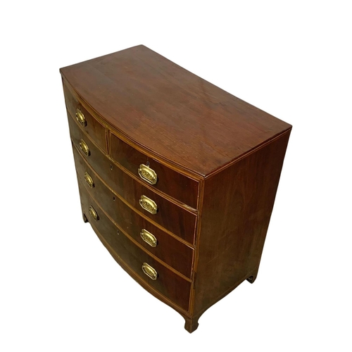 832 - A Georgian brass inlaid mahogany bow front chest of drawers. Circa 1820. 90 x 50 x 90.5cm