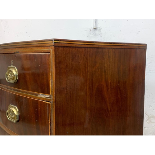 832 - A Georgian brass inlaid mahogany bow front chest of drawers. Circa 1820. 90 x 50 x 90.5cm