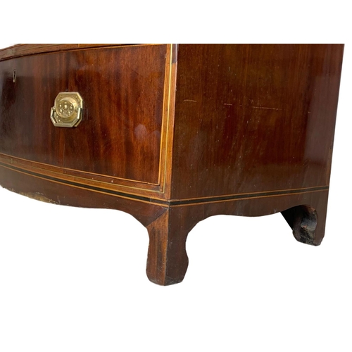 832 - A Georgian brass inlaid mahogany bow front chest of drawers. Circa 1820. 90 x 50 x 90.5cm