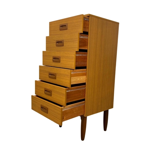 836 - A tall teak and formica Mid Century chest of drawers. 50 x 45 x 118.5cm