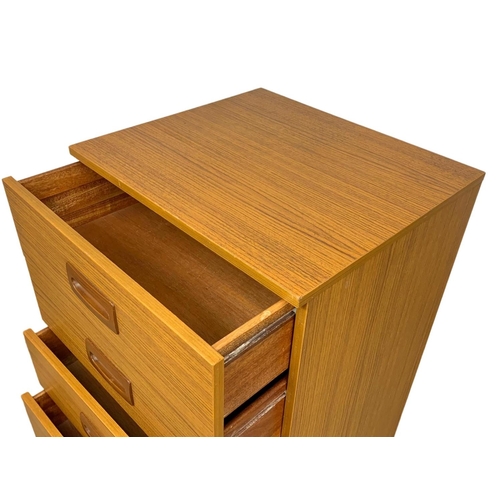 836 - A tall teak and formica Mid Century chest of drawers. 50 x 45 x 118.5cm