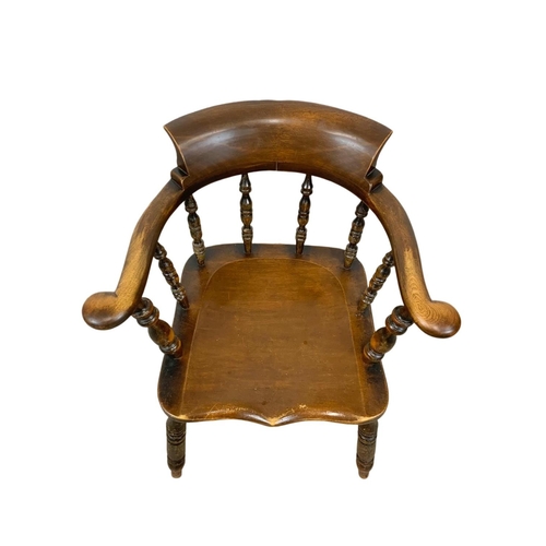 837 - A Victorian elm armchair.